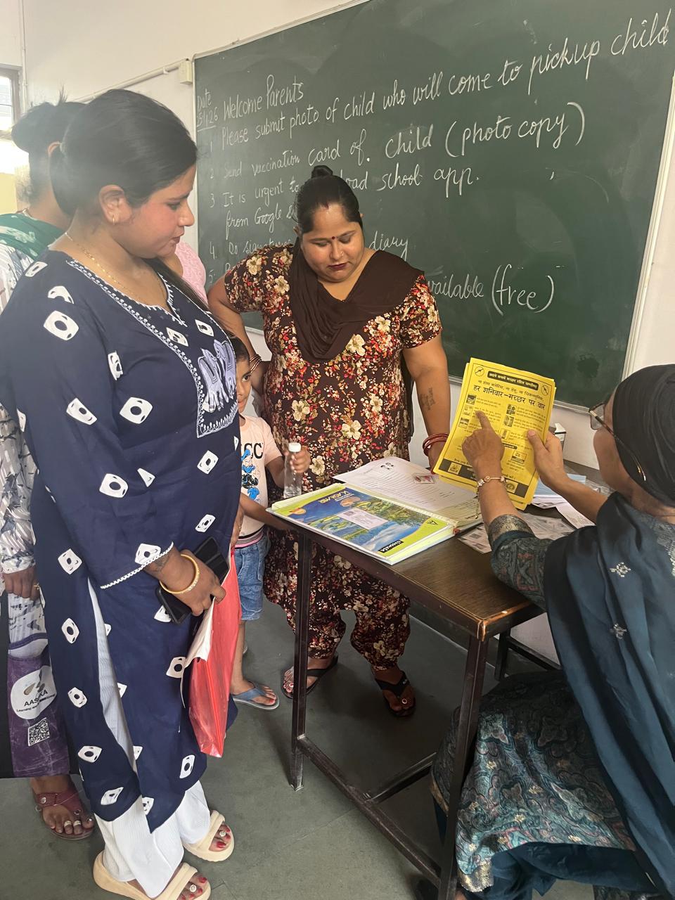 Teacher showing a yellow health awareness flyer to parents